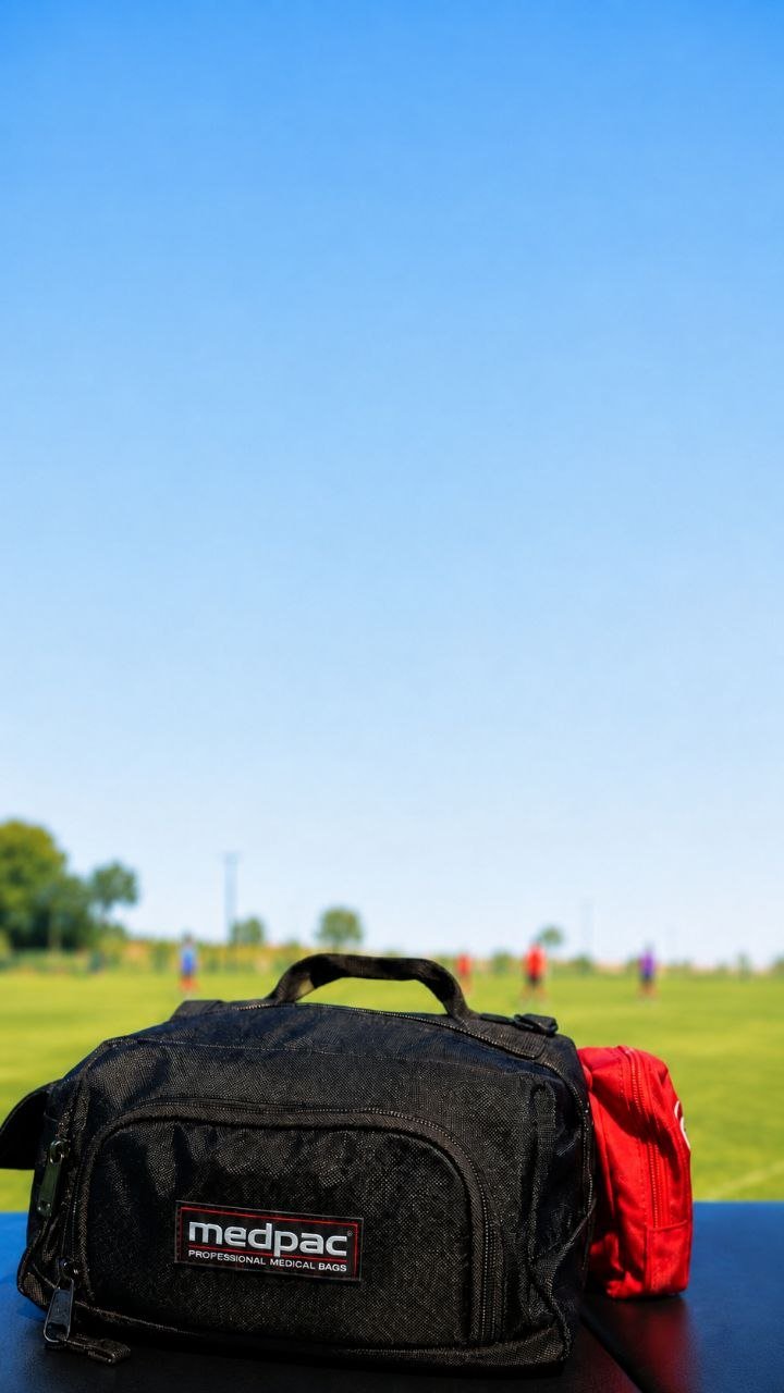 Athletic training kit set up on the sideline of a game